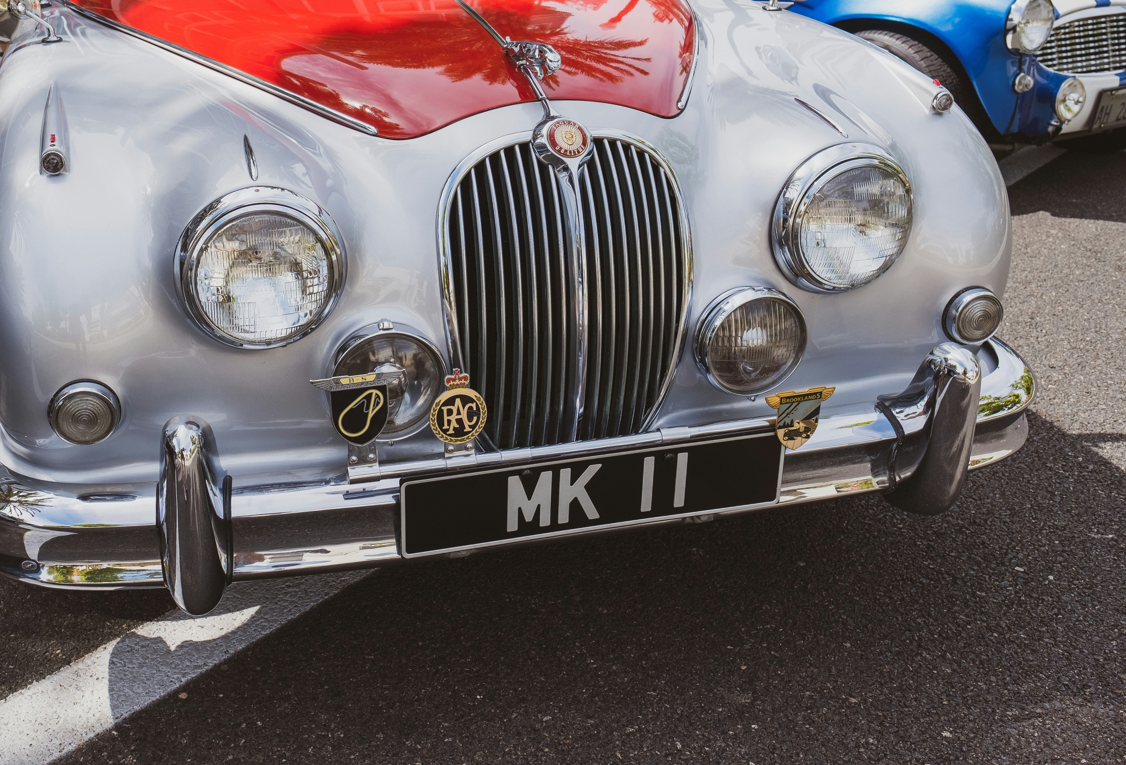 white and red Jaguar Mark 1 vehicle